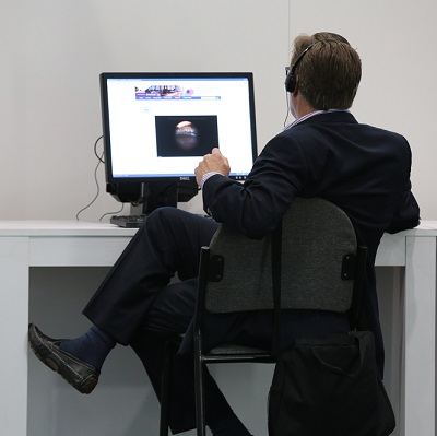 Doctor relaxes while watching webinar